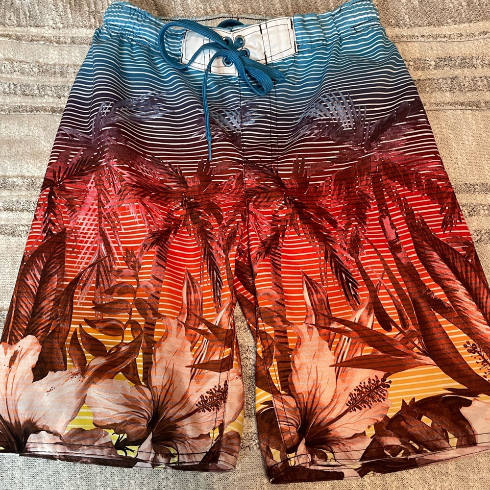 Vibrant Blue and Red Swim Trunks with Wave Pattern